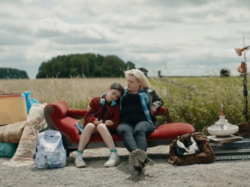 Daisy May Cooper, playing Costello, and Fleur Tashjian, as her daughter Iris, sit on a sofa on Sodbury Common in a scene from Rain Dogs. Picture: BBC/Sid Gentle Films Ltd