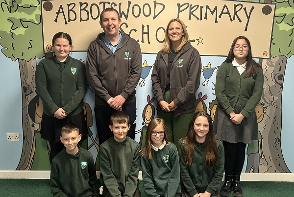 Abbotswood executive head teacher Rob Cockle and head of school Sarah Willoughby with pupils